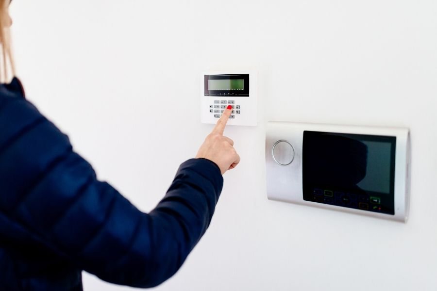 A Woman setting her home's security settings